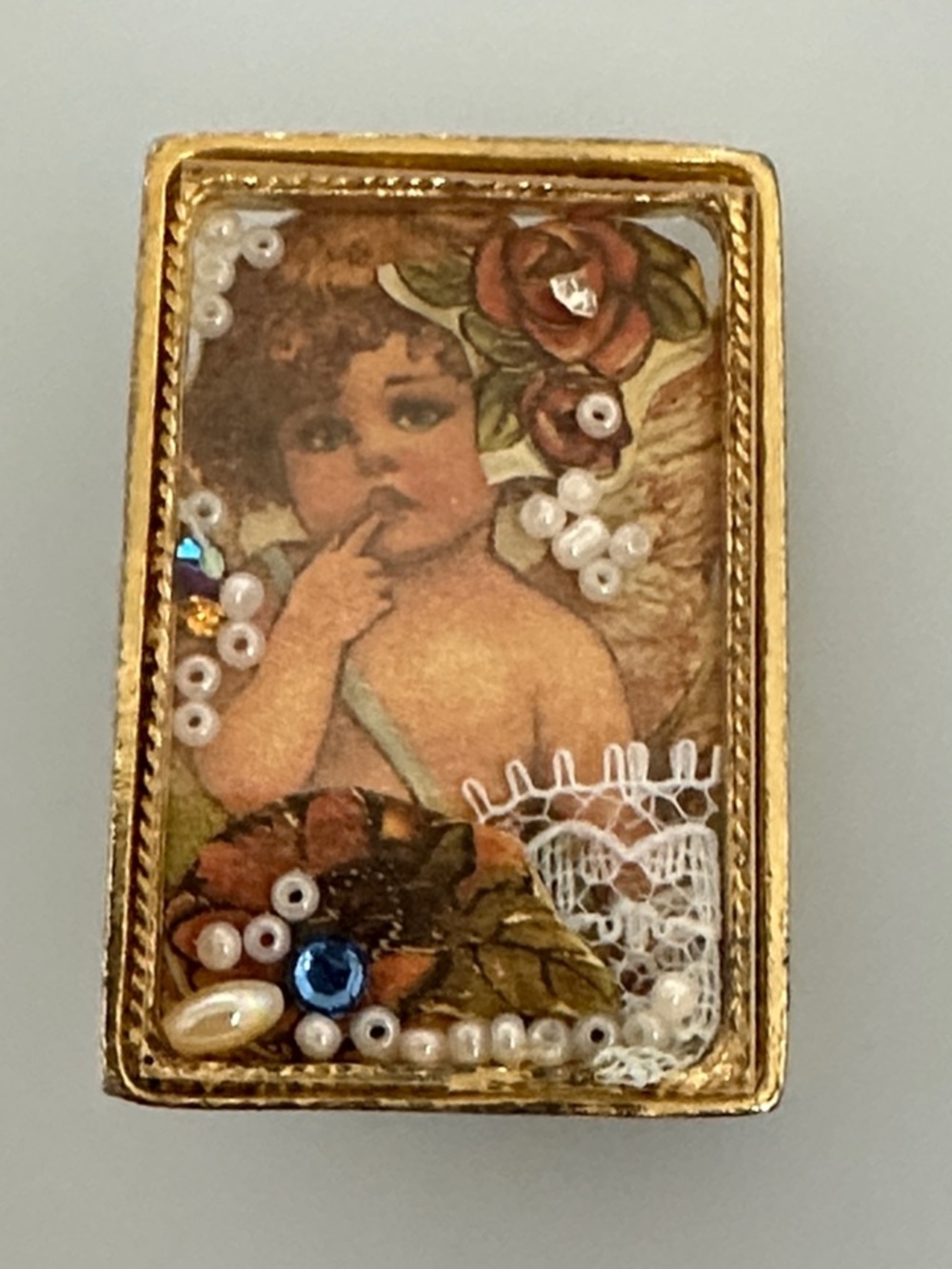 Vintage Gold-Tone Cherub Brooch with Blue and Pearl Accents